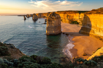 The rock stacks that comprise the Twelve Apostles at sunset in Port Campbell National Park. Great Ocean Road, Victoria State, Australia.