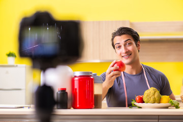 Young man blogging about food supplements