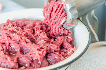 Cooking minced beef in a meat grinder close-up
