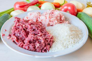 Beef and pork mince, rice and vegetables for making Albondigas, Mexican soup with meatballs