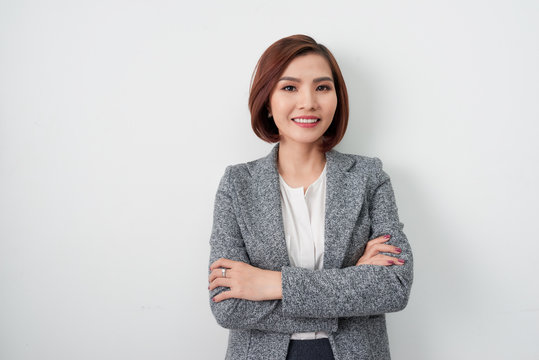 Entrepreneur young asian woman, business woman arms crossed on white background.