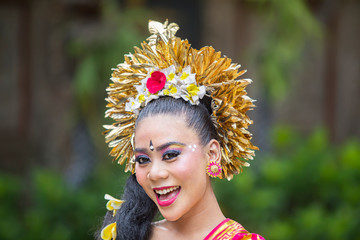 Happy dancer wearing traditional Balinese costume