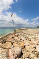 Flag on the pier at Kuta beach on Bali, Indonesia