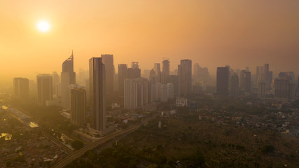 Fototapeta na wymiar Jakarta city with skyscrapers at sunset