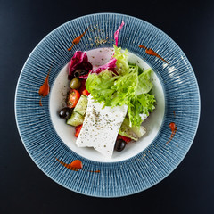 greek  salad on black background