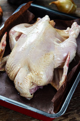 Whole raw chicken on deco form ready to bake