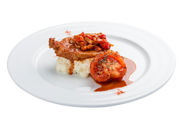 Chicken fillet in sweet and sour sauce with rice and vegetables. On a white background