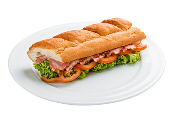 Sandwich with ham, tomatoes and greens