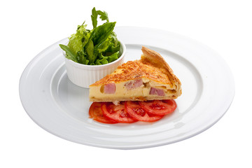 Quiche lorraine cake with greens on a white background