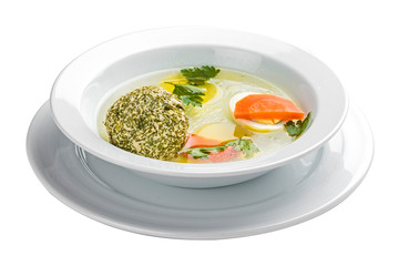 Broth with turkey with a meatball on a white background