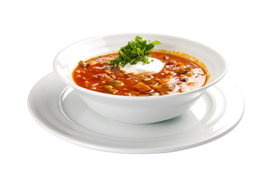 Soup "Solyanka". Soup with meat and pickles. A traditional Polish dish. On a white background