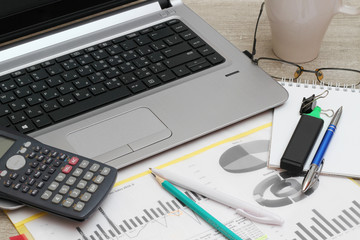 Business concept with a report, money and a calculator