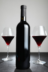 Cabernet red wine in a glass bottle.