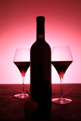 Love and romance, a bottle of red wine and a heart.