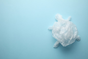 Fototapeta premium Sea plastic garbage, turtle from a disposable package. Copy space for text.