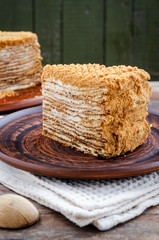 Traditional Honey Cake on a plate and on a wooden table