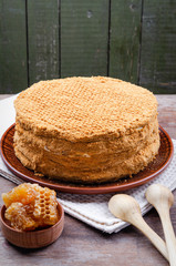 Traditional Honey Cake on a plate and on a wooden table