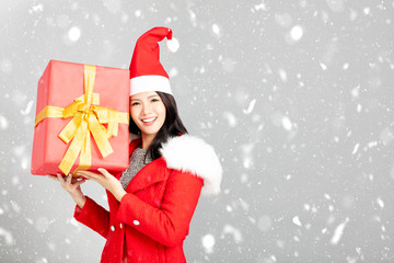 young woman with christmas gift box