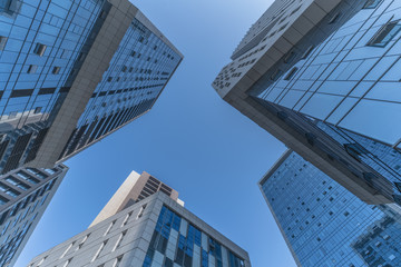 Fototapeta na wymiar Skyscrapers from a low angle view of unrecognized modern buildings