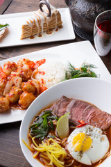 Asian lunch served on a wooden table