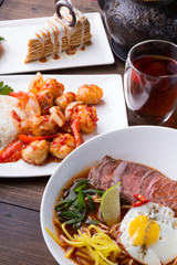 Asian lunch served on a wooden table