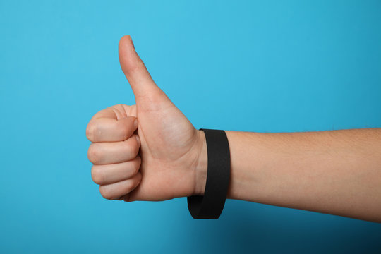 Identification concert black bracelet template, hand hospital security wristband mockup.