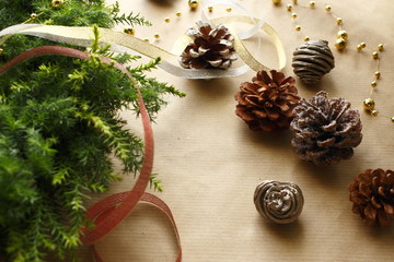 Christmas image of wreath, pine cone and ribbon