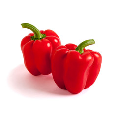 Two sweet peppers, red, lit from the right.