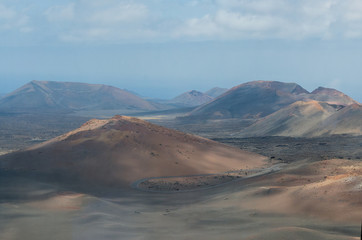 Fototapeta na wymiar .Valle del Silencio, Valley of Silence in Timanfaya National Park in Lanzarote,Canary Islands,Spain. The spectacular volcanic landscape background..