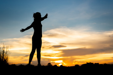 Fototapeta premium young woman warming up outdoors at park