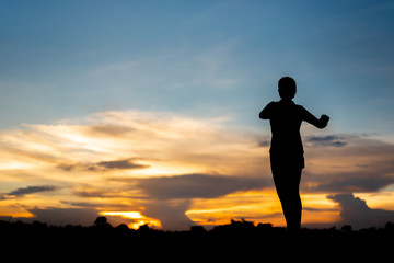 young woman warming up outdoors at park