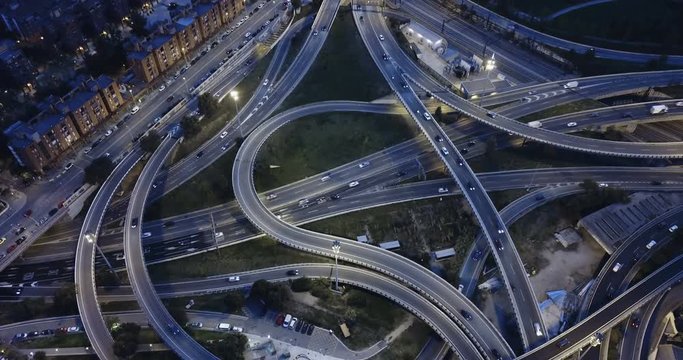 Aerial view of lighted highway road junctions at night
