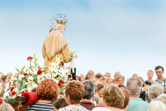 15 JULY 2018, TARRAGONA, SPAIN: People at celebration of religious holiday with Virgin Mary