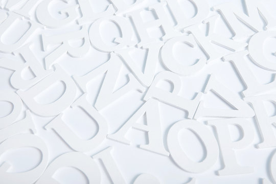  White wooden alphabet letters top view on white background