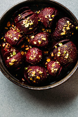 Baked whole beet with olive oil, herbs and pistachios