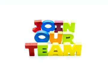 Join Our Team text written with colourful wooden letters, isolated over white with copy space