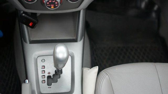 Automatic transmission, automatic gear shift, is moved from P Park to D Drive and back. Car start, starting a modern car.