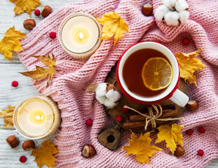 Fototapeta na wymiar autumn flat lay with cup of tea and leaves