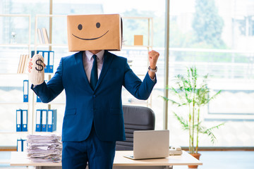 Happy man with box instead of his head