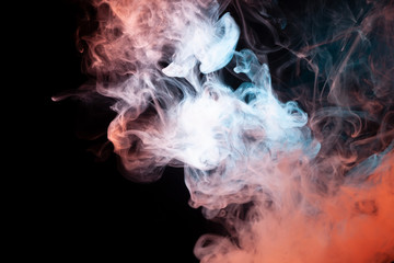 Background of blue, white and pink wavy smoke on a black isolated ground. Abstract pattern of steam from vape.