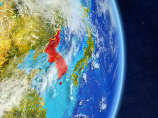 Korea on planet planet Earth with country borders. Extremely detailed planet surface and clouds.
