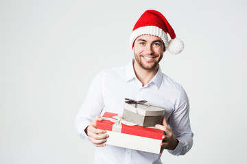 Happy man with gift boxes on white background.