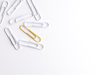 White and yellow paper clips.
