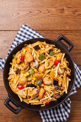 Indonesian pasta with chicken, pieces of bamboo and mushrooms.