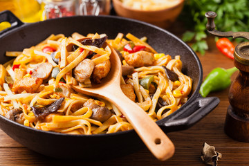 Indonesian pasta with chicken, pieces of bamboo and mushrooms.