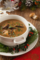 Traditional mushroom soup, made from porcini mushrooms. Christmas decoration.