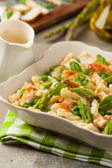 Italian pasta fusilli. Salad with chicken and asparagus in Béchamel sauce.