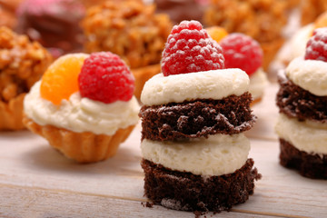Catering sweets, closeup of various kinds of cakes on event or wedding reception