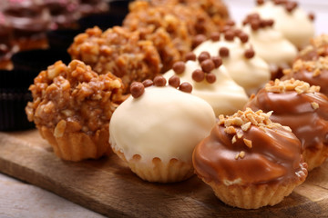 Catering sweets, closeup of various kinds of cakes on event or wedding reception