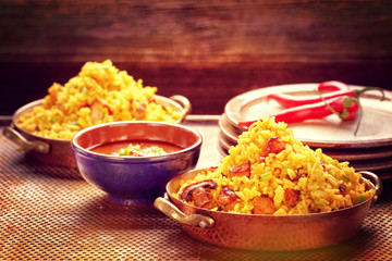 Chicken with basmati rice fried in stainless pan